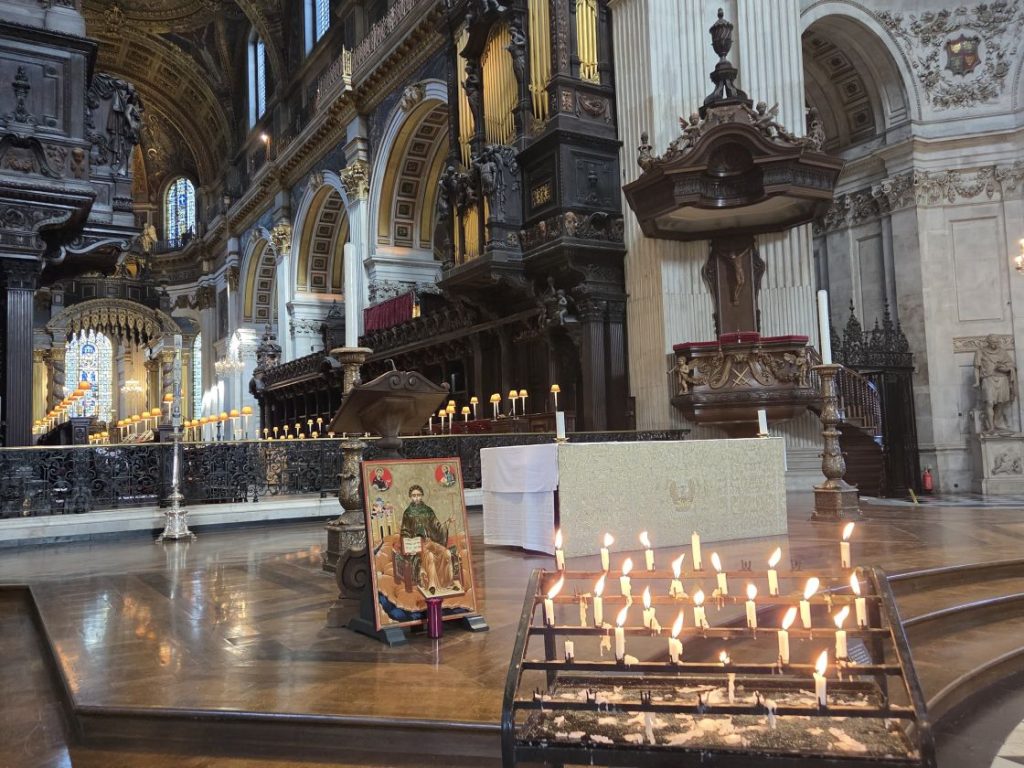 Candles lit in memory of loved ones shine next to the pulpit at St Paul's Cathedral Picture: Phil Creighton