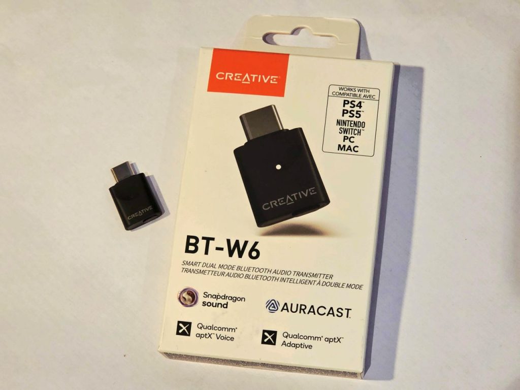 The Creative BT-W6 pictured next to the box, on a white background