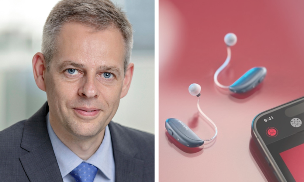 Thomas Olsgaard next to the GN Group ReSound Vivia hearing aids and the left hand corner of a mobile phone