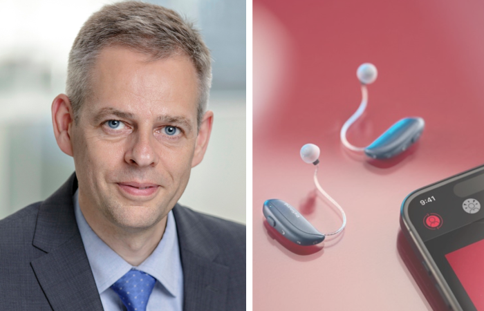 Thomas Olsgaard next to the GN Group ReSound Vivia hearing aids and the left hand corner of a mobile phone