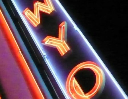 A neon sign with the letters WYO