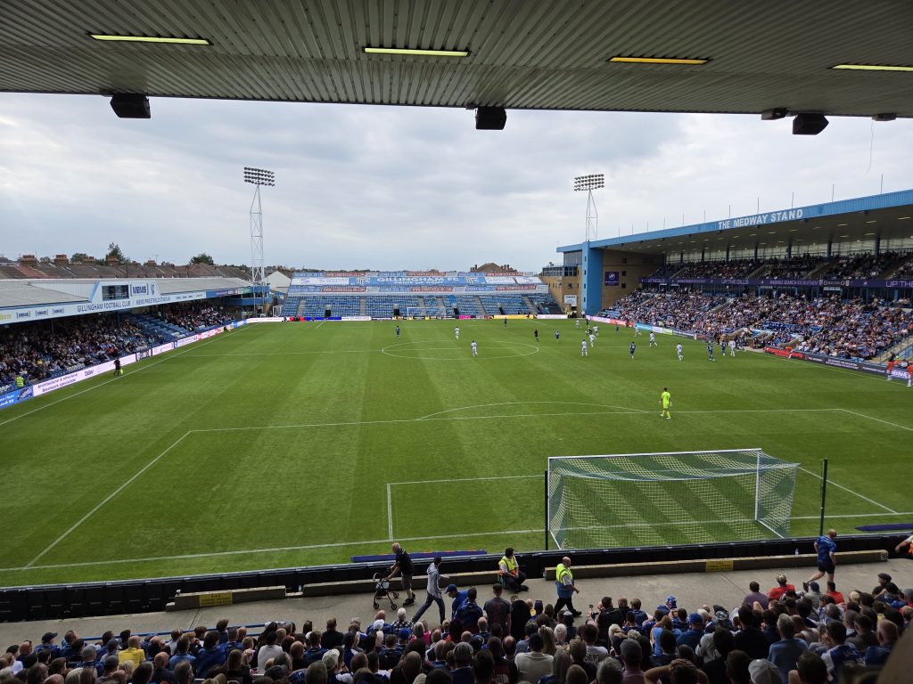 The view from the Rainham End at Gillingham FC – a row of speakers can be seen at the top of the stadium roof