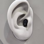 EUHA 2025: Oticon Zeal powers up with Auracast and next gen AI The Oticon Zeal on display at EUHA - it is situated in a 3D mock-up of an ear