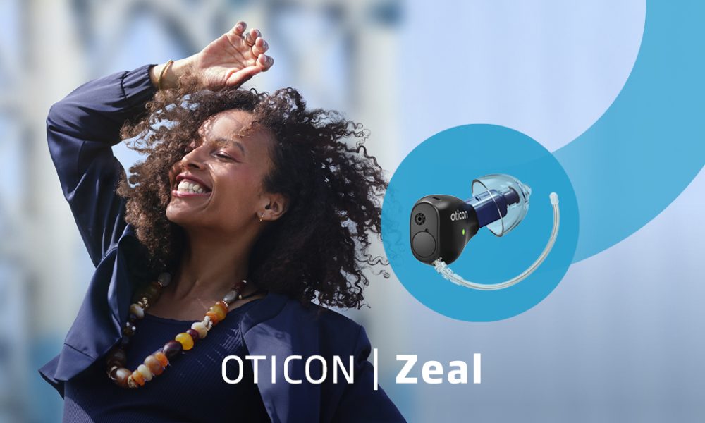 Oticon launch picture for Oticon Zeal featuring a happy woman dancing with her hand in the air. In a blue swoosh is a picture of the Oticon Zeal which comes with Google Fast Pair