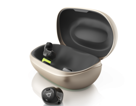 Phonak's Virto R Infinio hearing aids. One is out of the charging case, the other is in it