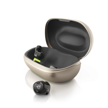 Phonak's Virto R Infinio hearing aids. One is out of the charging case, the other is in it