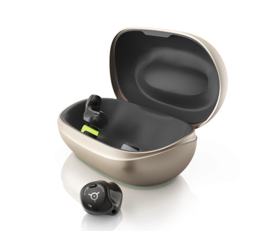 Phonak's Virto R Infinio hearing aids. One is out of the charging case, the other is in it