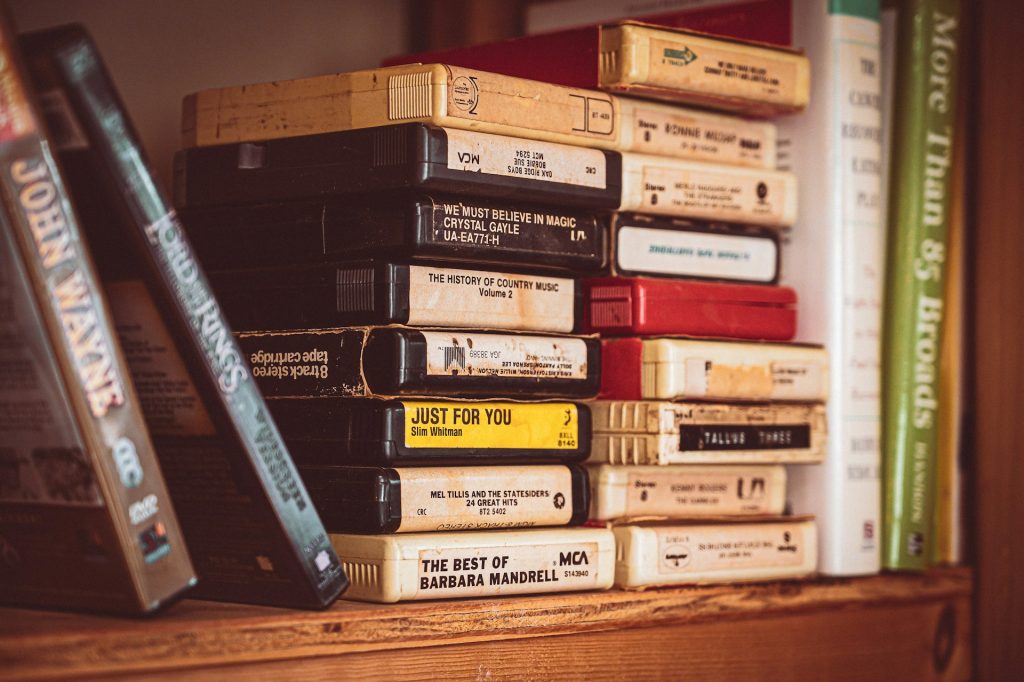 A shelf full of 8-track cassettes