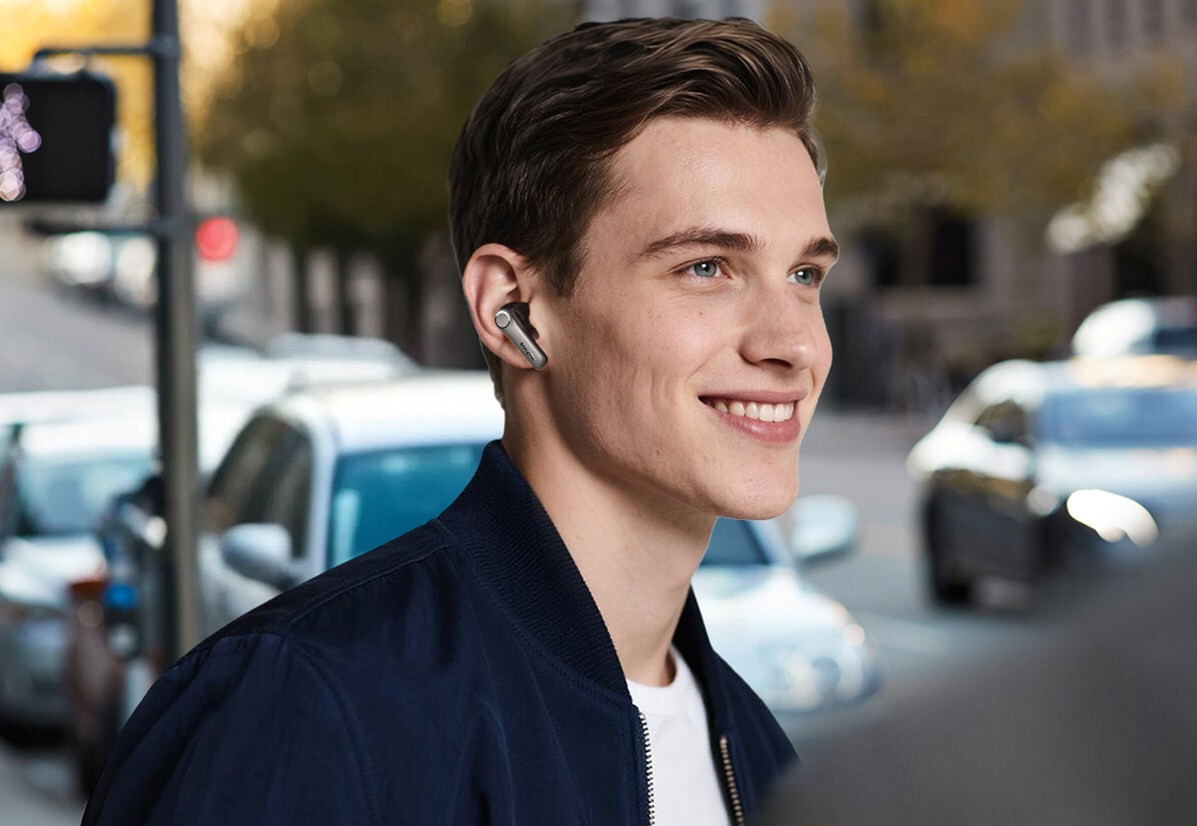 A man wearing the EarFun Air Pro 4+