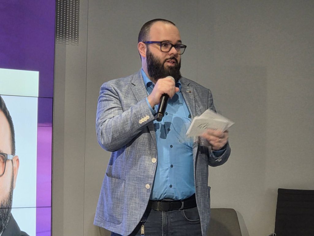 A man speaking into a micrphone